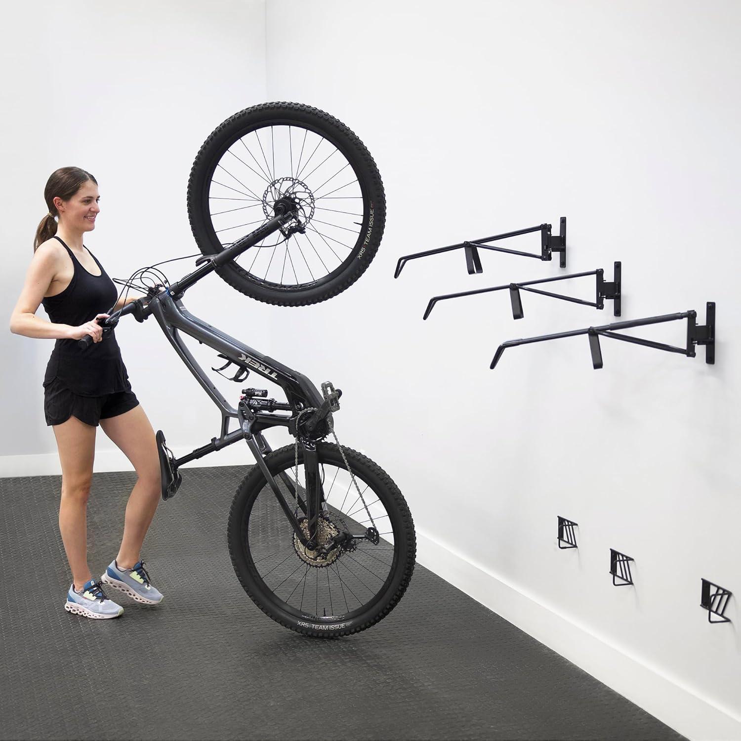 imageStoreYourBoard SwivelStow Road ampamp Gravel Bike Storage 2 Pack  Heavy Duty Bike Hanger NoLift Bike Wall Mount for Garage Bike Storage Holds 70 lbs PatentPending2 Pack