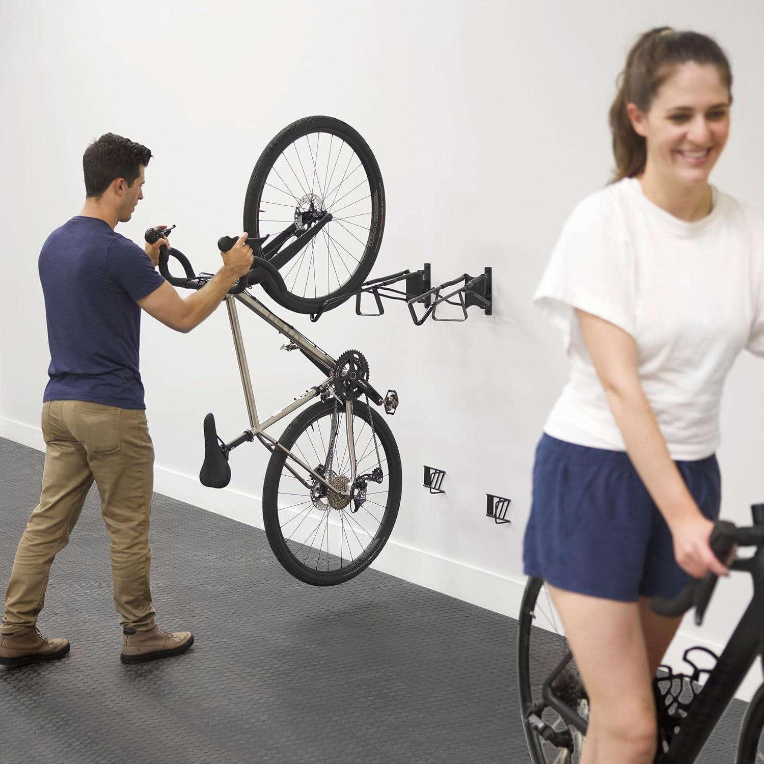 imageStoreYourBoard SwivelStow Road ampamp Gravel Bike Storage 2 Pack  Heavy Duty Bike Hanger NoLift Bike Wall Mount for Garage Bike Storage Holds 70 lbs PatentPending4 Pack